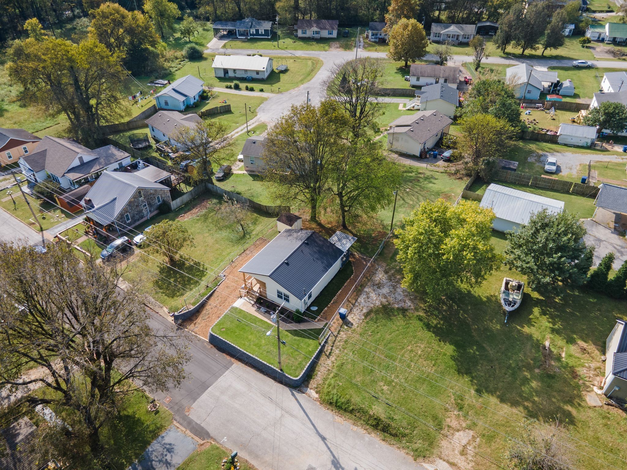 104 East Merchant Street Mount Pleasant, TN 38474 - Photo 27 of 30 an aerial view of a house with a garden