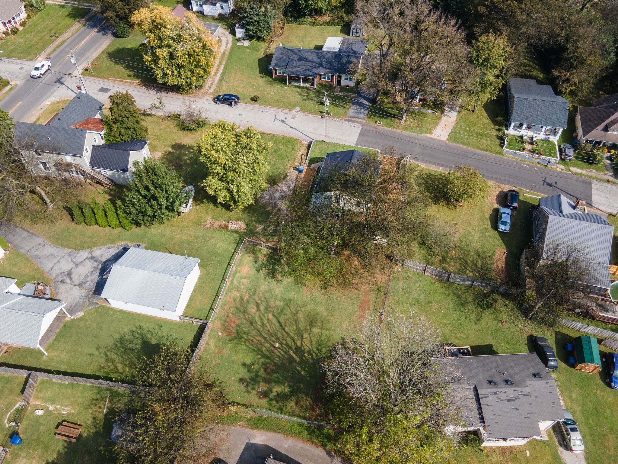104 East Merchant Street Mount Pleasant, TN 38474 - Photo 28 of 30 an aerial view of residential houses with outdoor space
