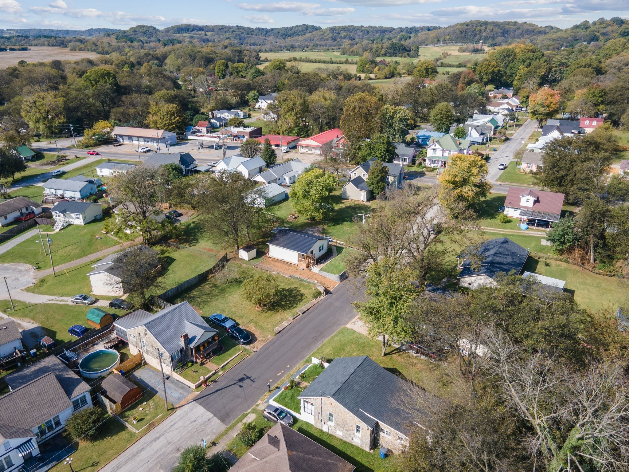 104 East Merchant Street Mount Pleasant, TN 38474 - Photo 30 of 30 an aerial view of residential houses with outdoor space