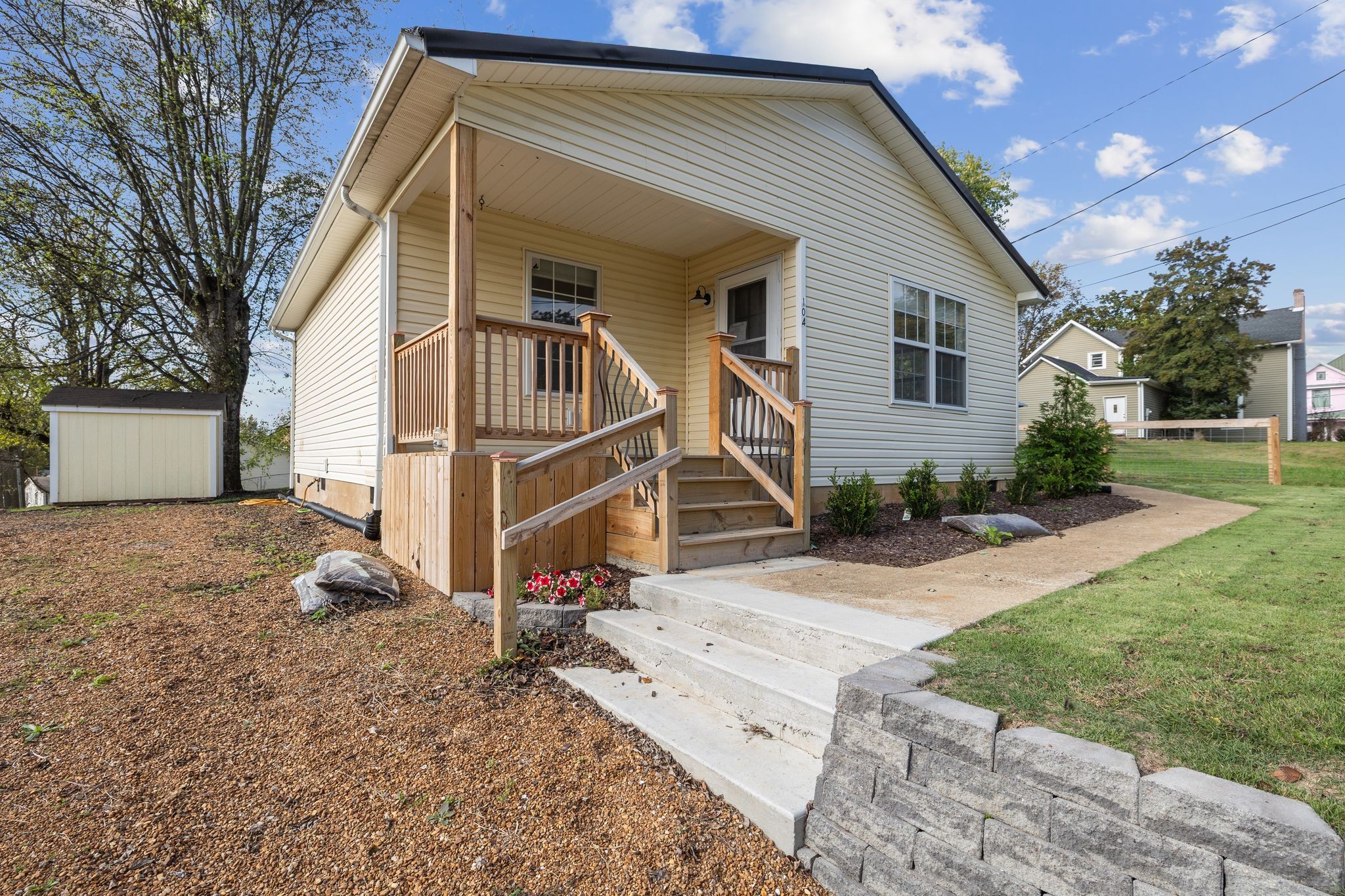 104 East Merchant Street Mount Pleasant, TN 38474 - Photo 4 of 30 a view of a house with a yard