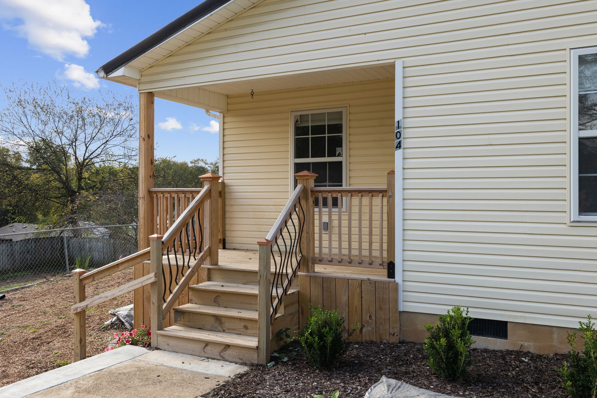 104 East Merchant Street Mount Pleasant, TN 38474 - Photo 5 of 30 a view of a house with wooden deck