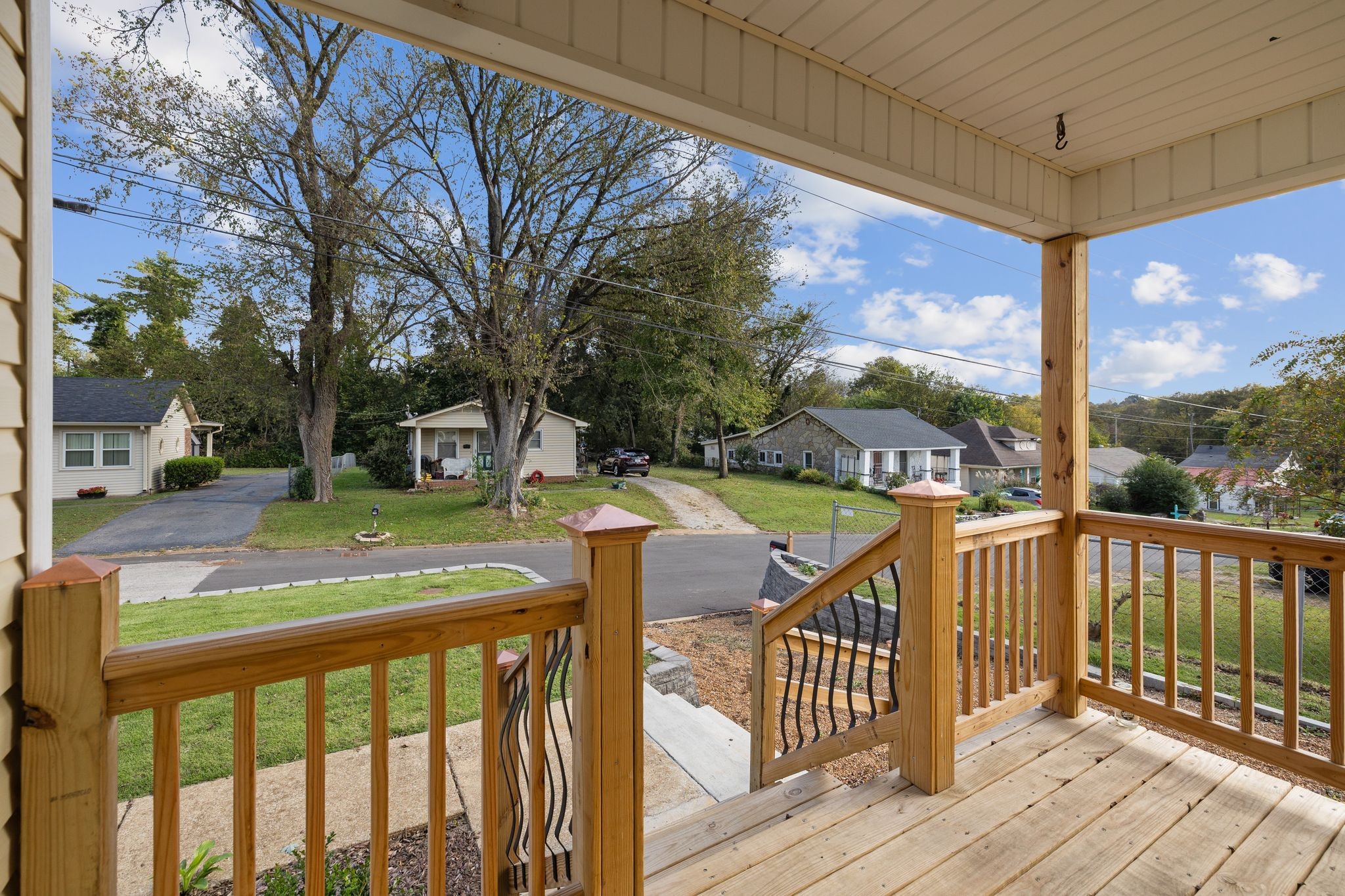 104 East Merchant Street Mount Pleasant, TN 38474 - Photo 7 of 30 a view of a wooden deck with city view