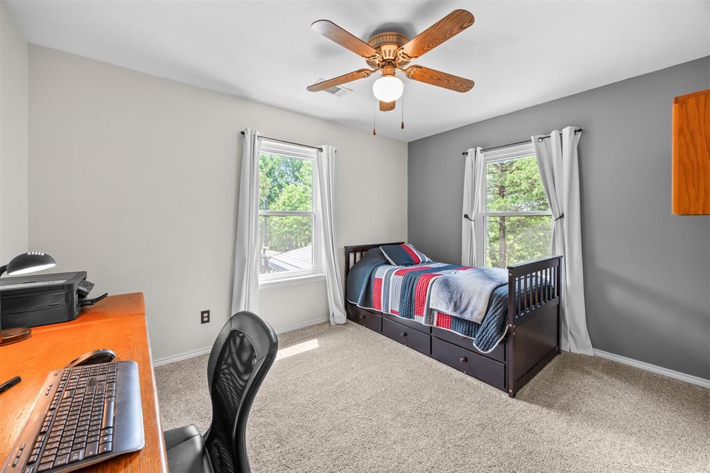 881 Wild Road Van Alstyne, TX 75495 - Photo 20 of 40 a bedroom with a bed and a window