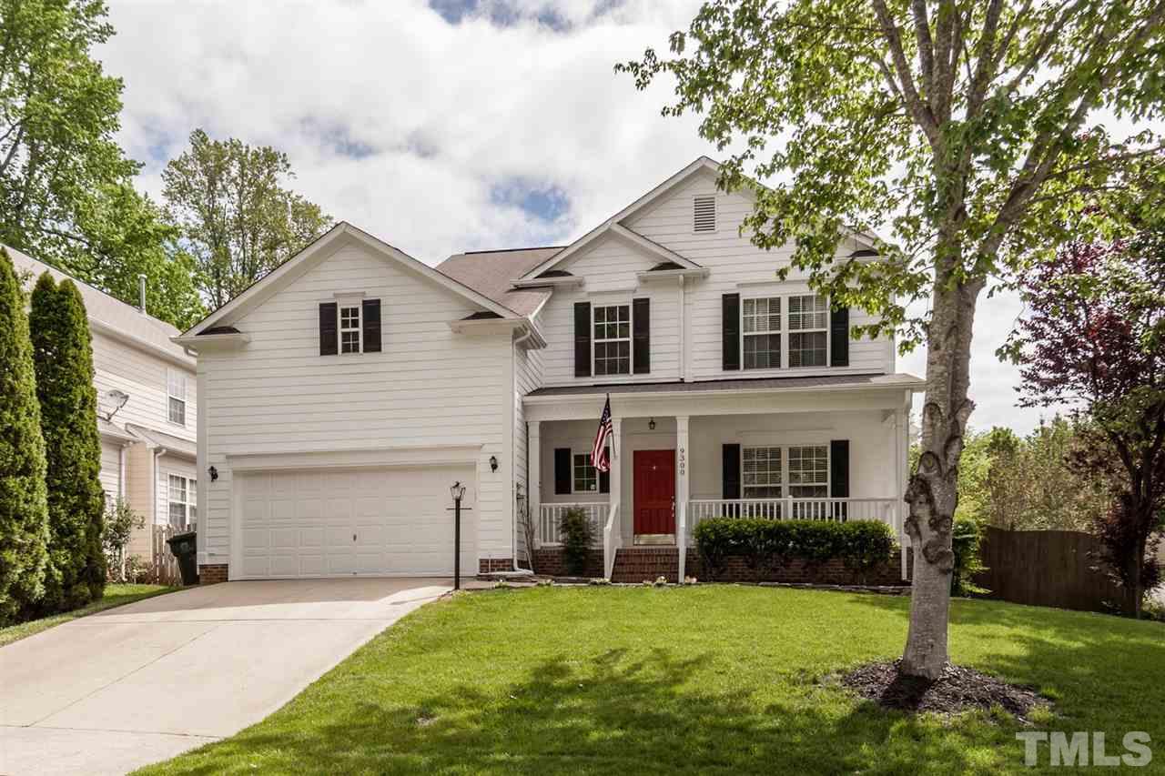 9300 Shallcross Way Raleigh, NC 27617 - Photo 1 of 25 a front view of a house with a yard