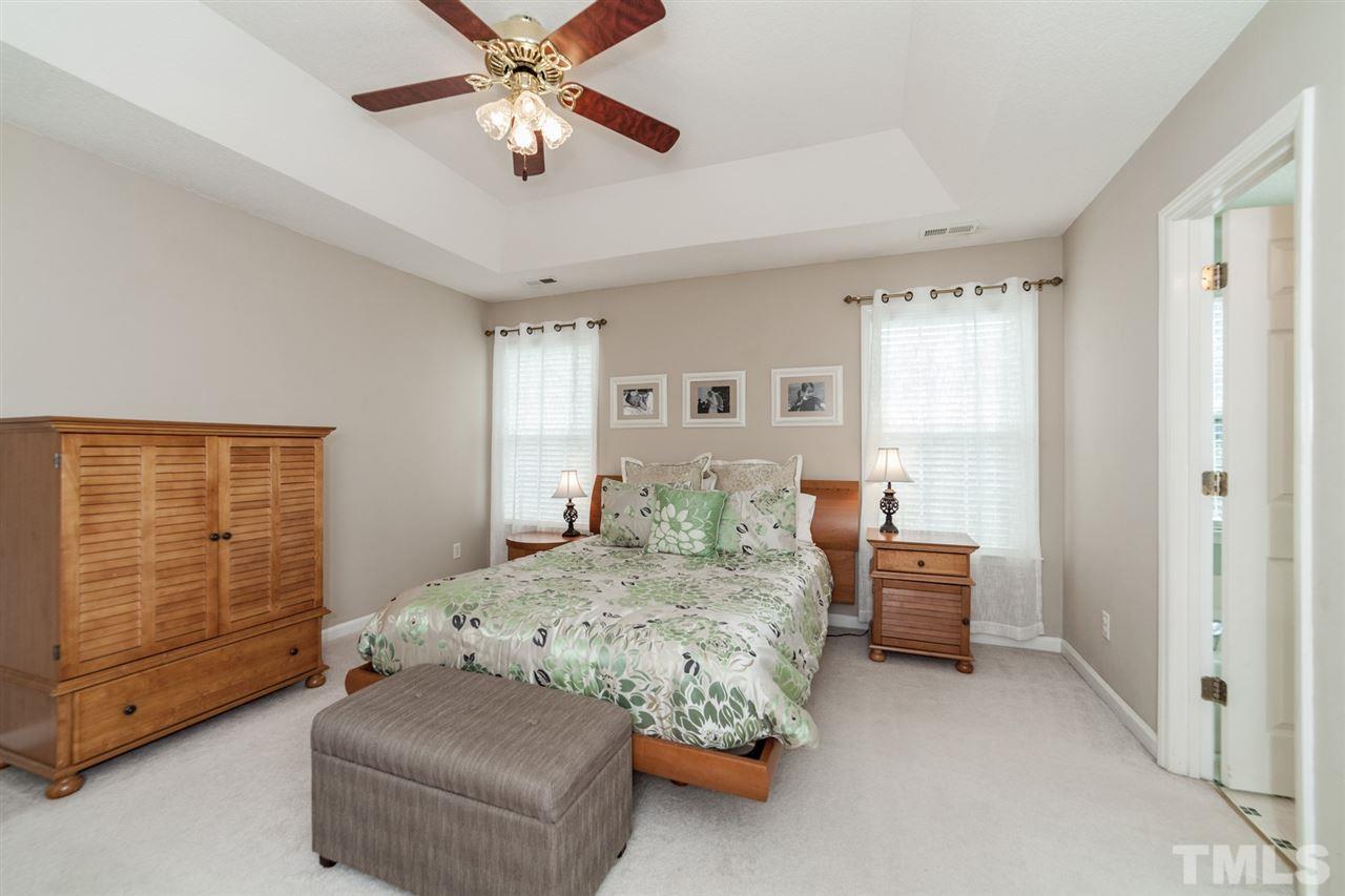 9300 Shallcross Way Raleigh, NC 27617 - Photo 11 of 25 a bedroom with bed and window