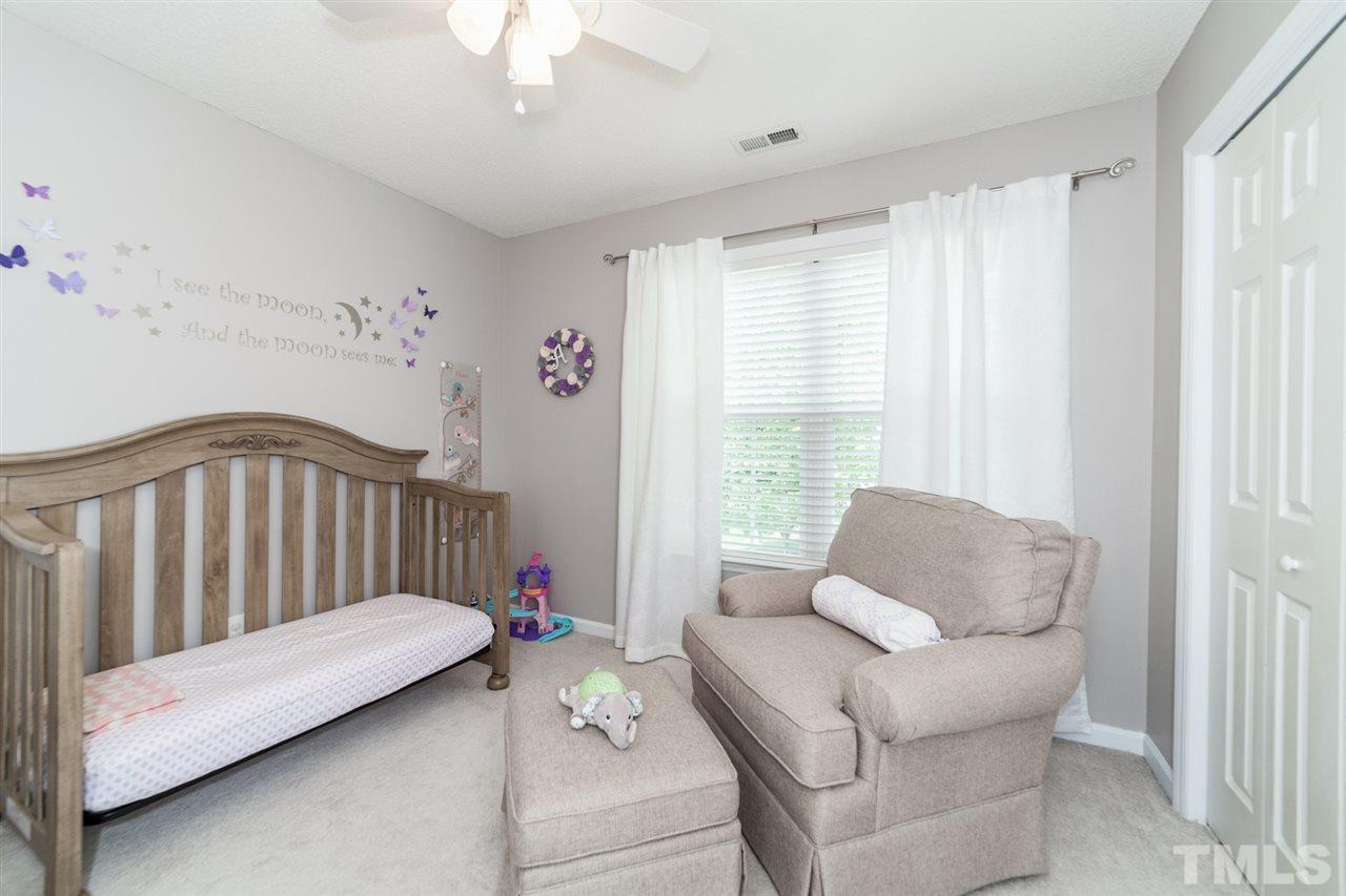9300 Shallcross Way Raleigh, NC 27617 - Photo 19 of 25 a living room with furniture and a window