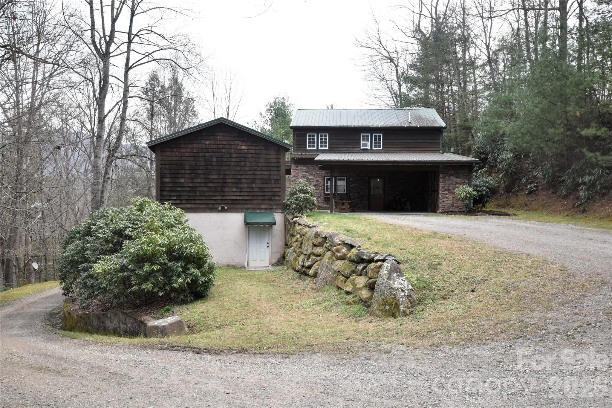 85 Homish Garden Waynesville, NC 28785 - Photo 1 of 32 a front view of a house with garden