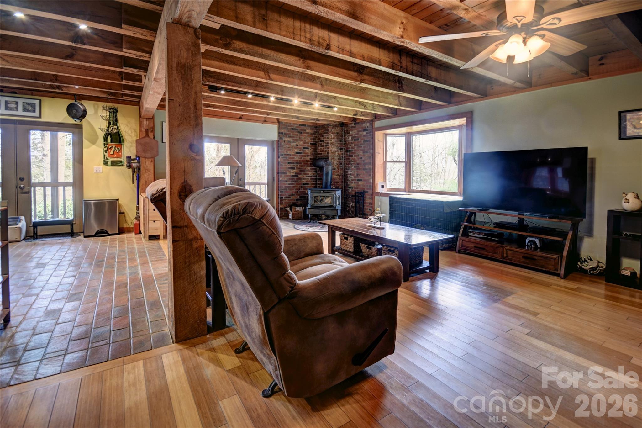 85 Homish Garden Waynesville, NC 28785 - Photo 11 of 32 a living room with furniture and a flat screen tv