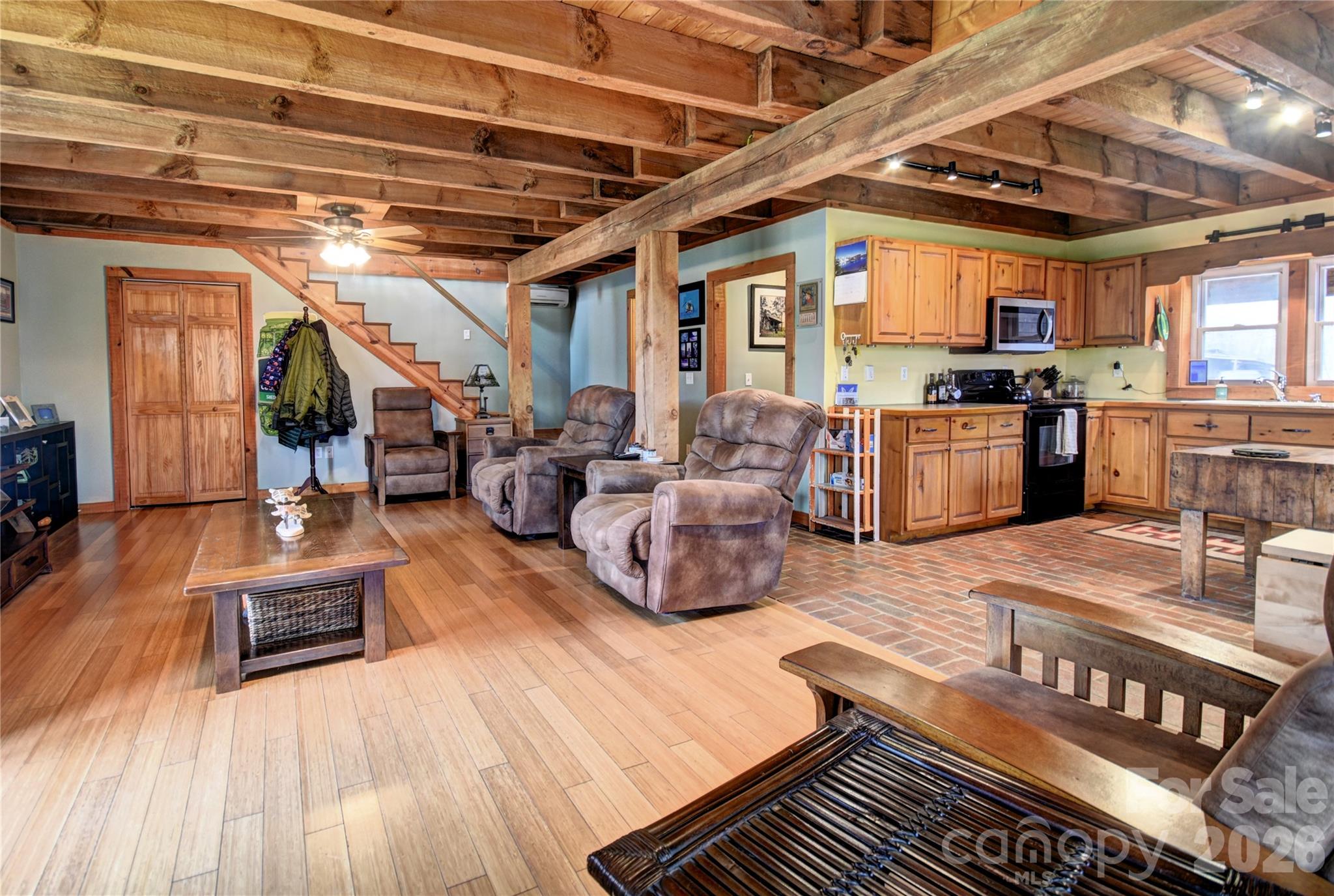 85 Homish Garden Waynesville, NC 28785 - Photo 12 of 32 a living room with lots of furniture and kitchen view