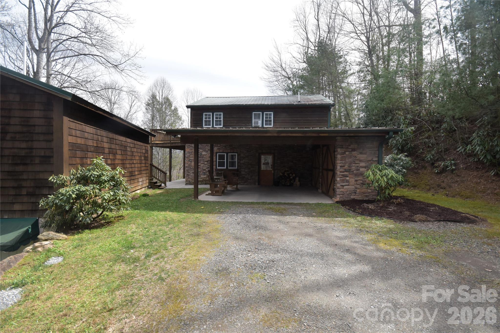 85 Homish Garden Waynesville, NC 28785 - Photo 2 of 32 a front view of a house with garden