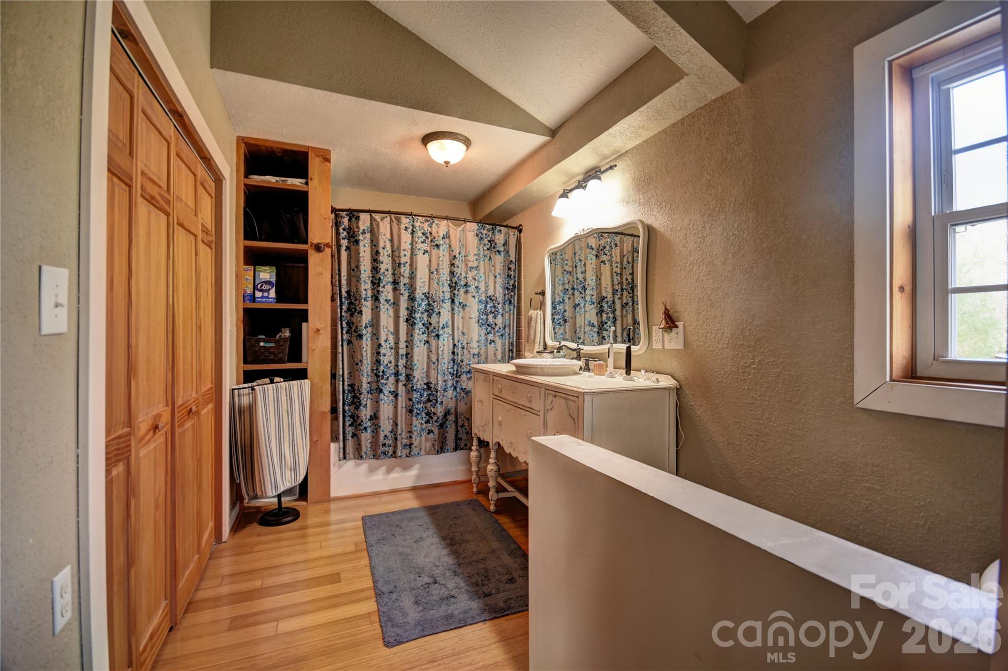 85 Homish Garden Waynesville, NC 28785 - Photo 22 of 32 a view of a hallway with wooden floor and living room