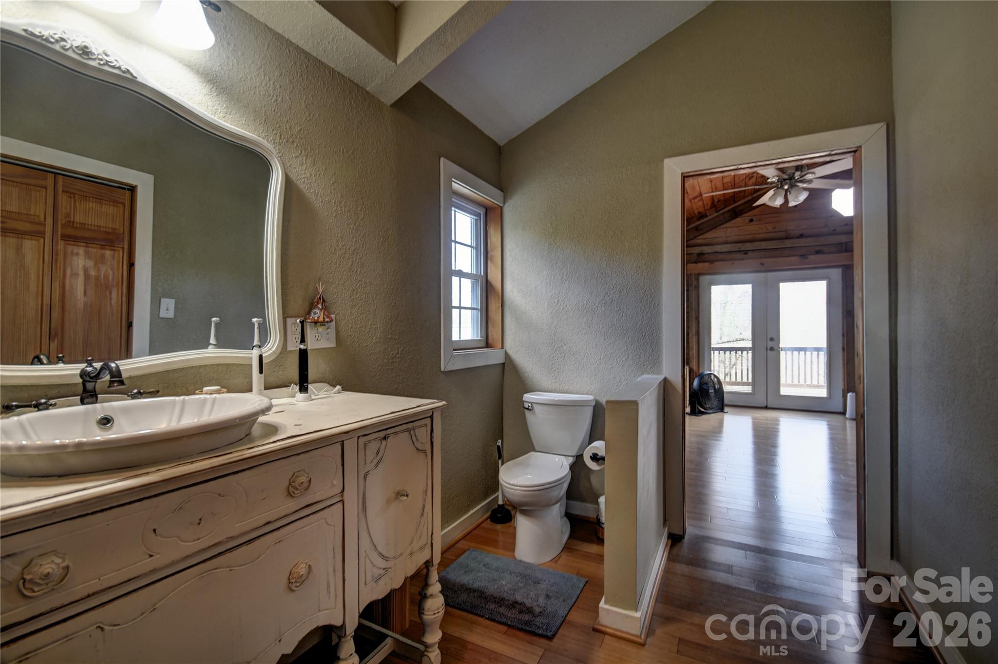 85 Homish Garden Waynesville, NC 28785 - Photo 23 of 32 a spacious bathroom with a sink and a mirror