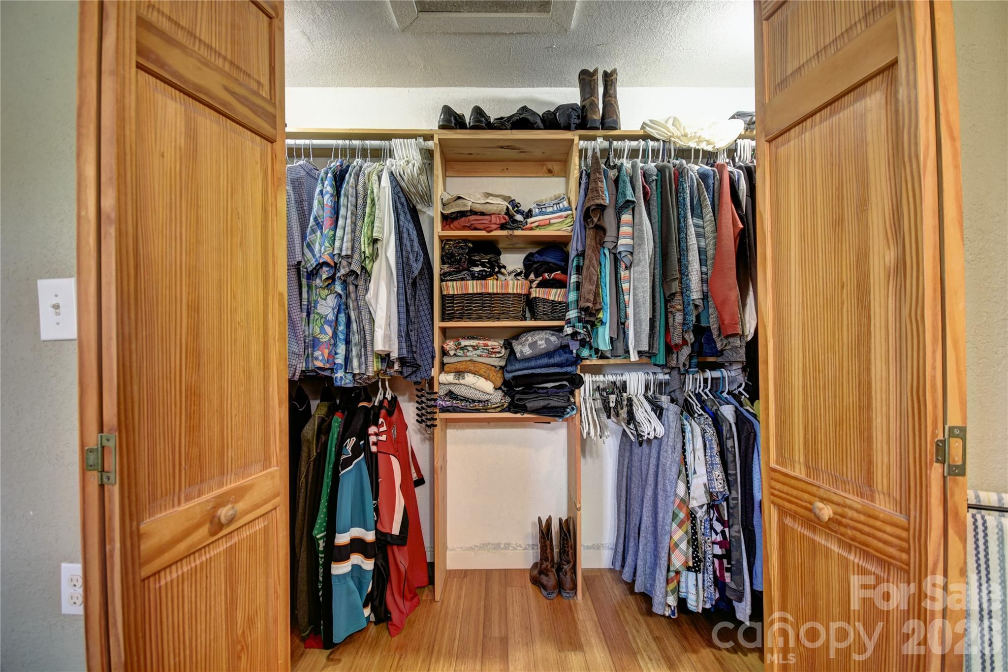 85 Homish Garden Waynesville, NC 28785 - Photo 25 of 32 a view of walk in closet with clothes