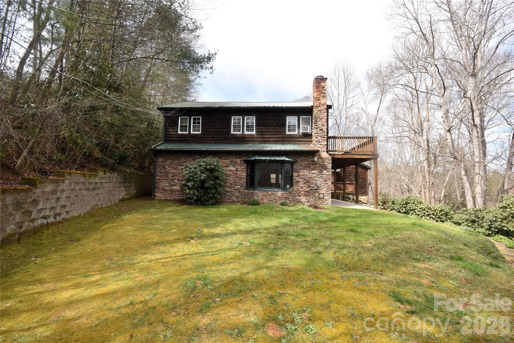85 Homish Garden Waynesville, NC 28785 - Photo 3 of 32 a front view of a house with a garden