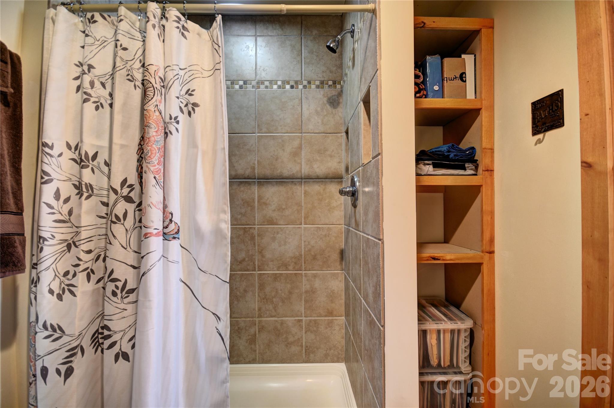 85 Homish Garden Waynesville, NC 28785 - Photo 31 of 32 a bathroom with a bathtub and a shower