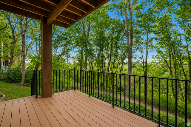1429 Chateau Ridge Way Sandy, UT 84092 - Photo 14 of 22 Expansive deck featuring composite decking and black metal railings
