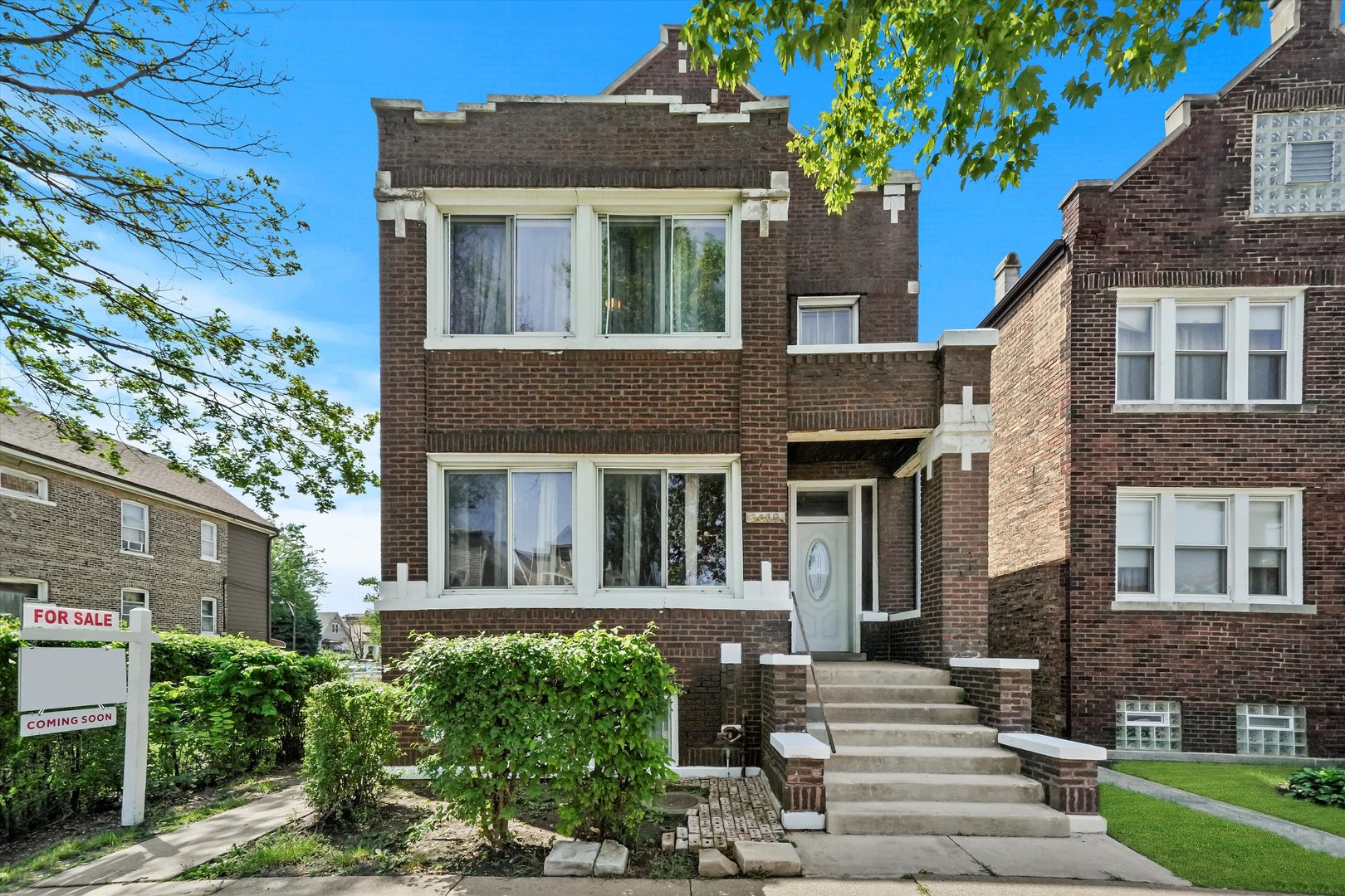 3009 West 40th Place Chicago, IL 60632 - Photo 1 of 33 a front view of a house with garden