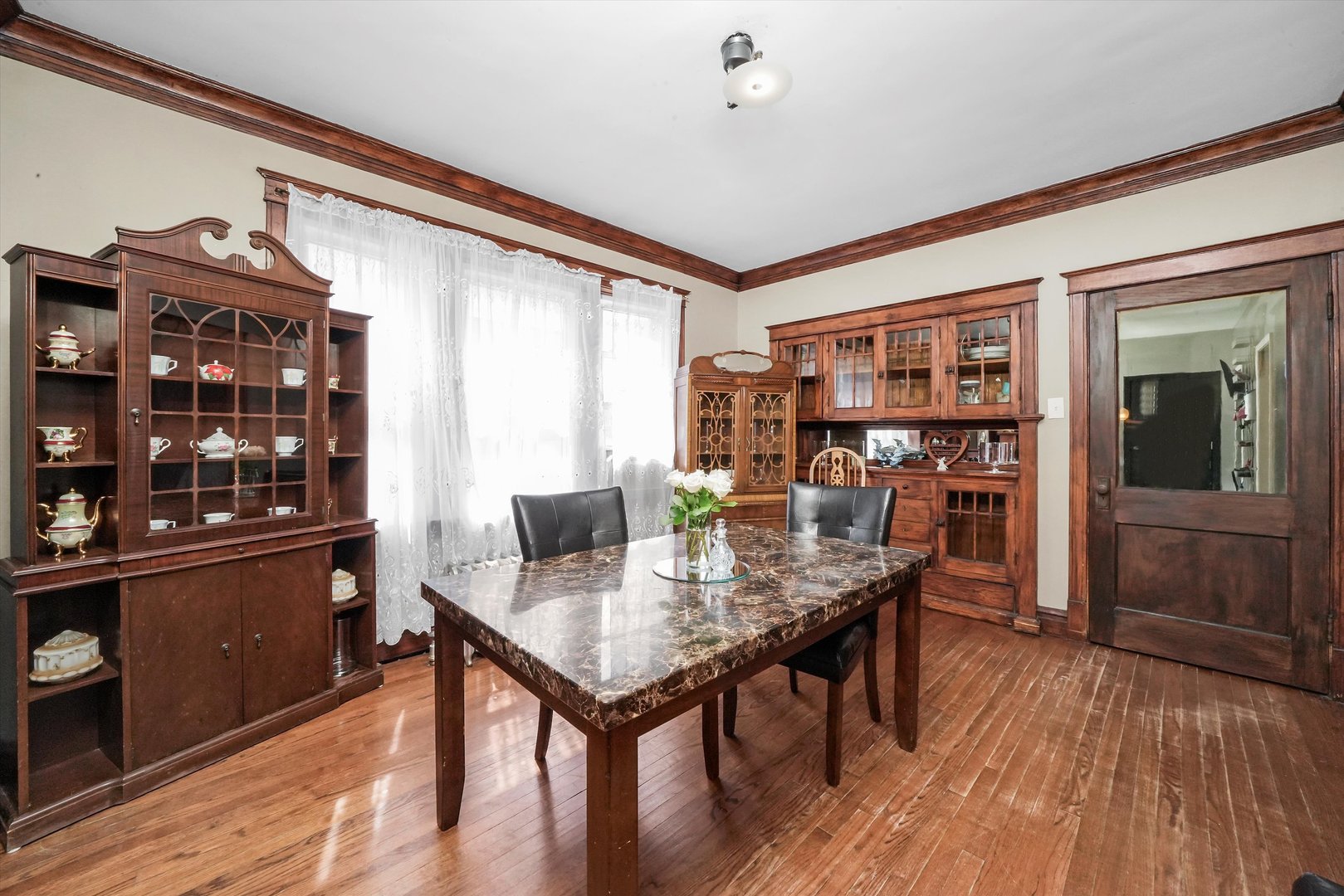 3009 West 40th Place Chicago, IL 60632 - Photo 15 of 33 a view of a dining room with furniture and wooden floor