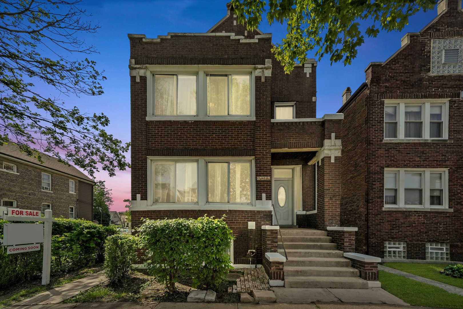 3009 West 40th Place Chicago, IL 60632 - Photo 2 of 33 a front view of a house with garden
