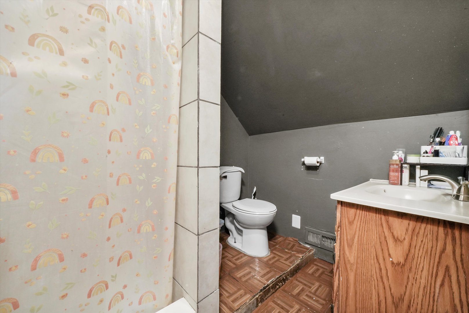 3009 West 40th Place Chicago, IL 60632 - Photo 24 of 33 a bathroom with a sink a toilet and shower curtain