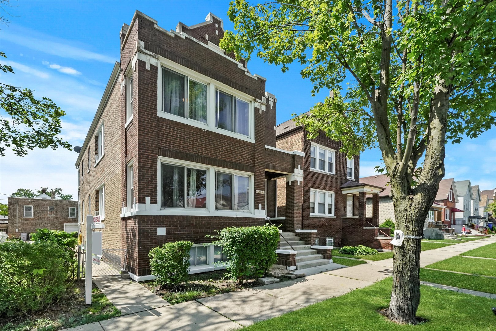 3009 West 40th Place Chicago, IL 60632 - Photo 33 of 33 a front view of a house with garden and trees