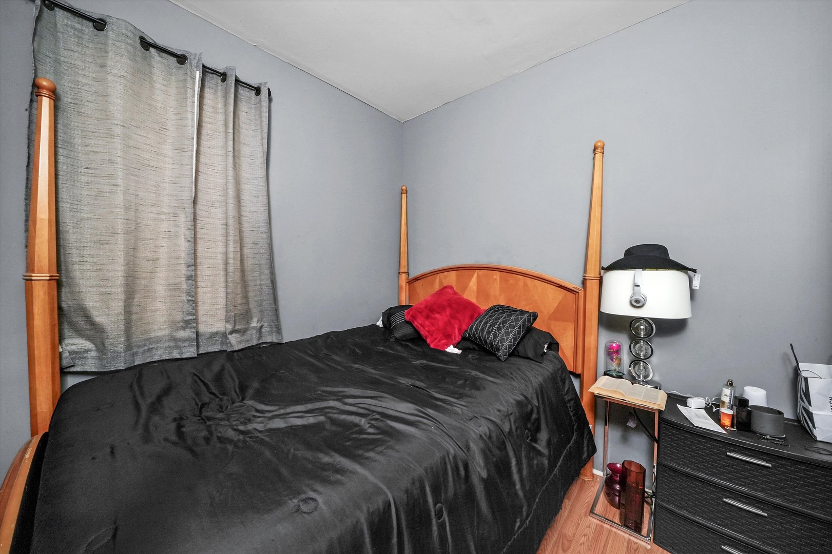 3009 West 40th Place Chicago, IL 60632 - Photo 9 of 33 a bedroom with a bed and a chandelier