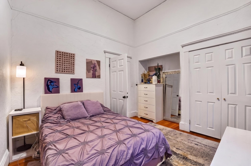 8 Garrison Street, Unit 111 Boston, MA 02116 - Photo 15 of 15 a bedroom with a bed and a cabinets