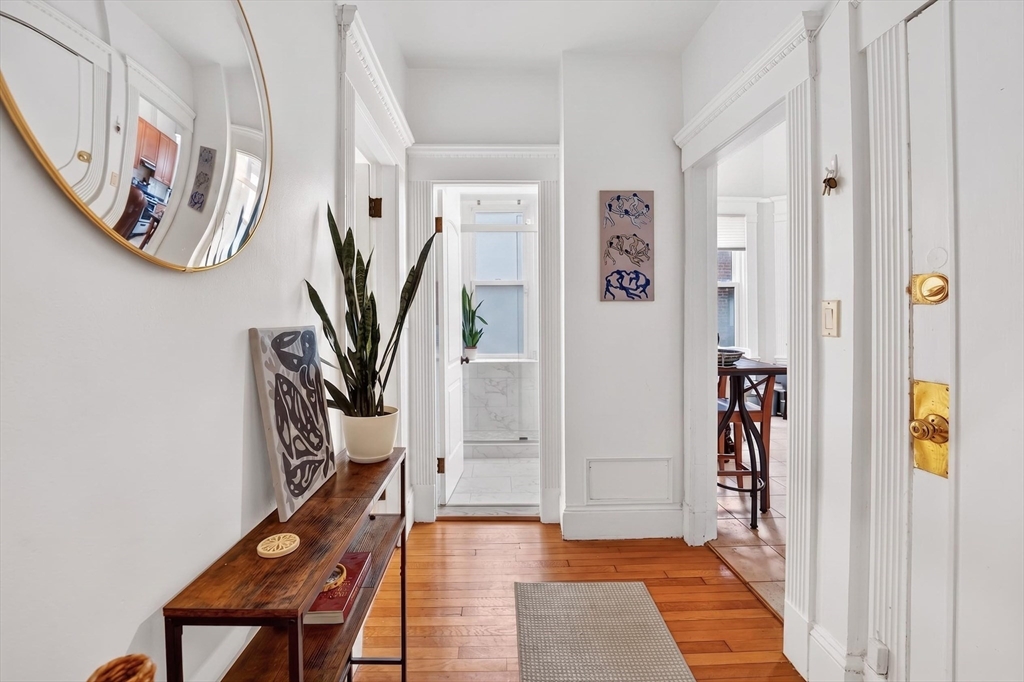 8 Garrison Street, Unit 111 Boston, MA 02116 - Photo 6 of 15 a view of a hallway with front door