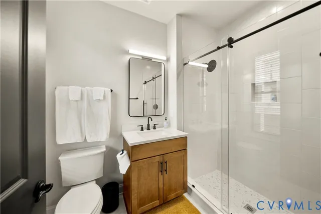 a bathroom with a sink toilet tub and shower