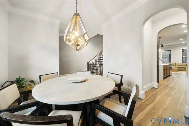 a view of a dining room with furniture and wooden floor