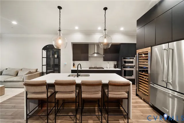 a kitchen with a table chairs refrigerator and microwave