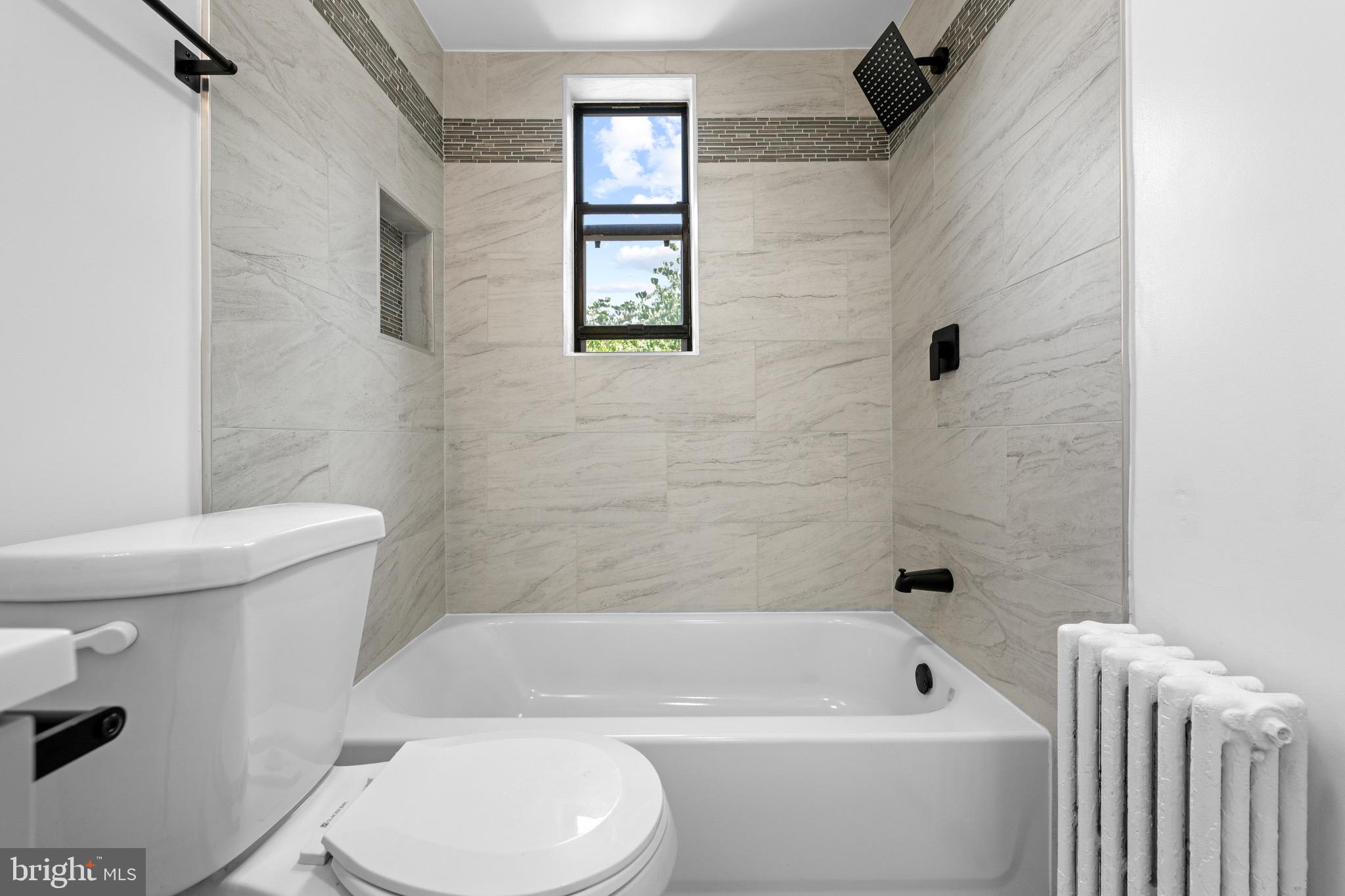 4717 1st Street Southwest, Unit 203 Washington, DC 20032 - Photo 11 of 16 Simple and clean full bath