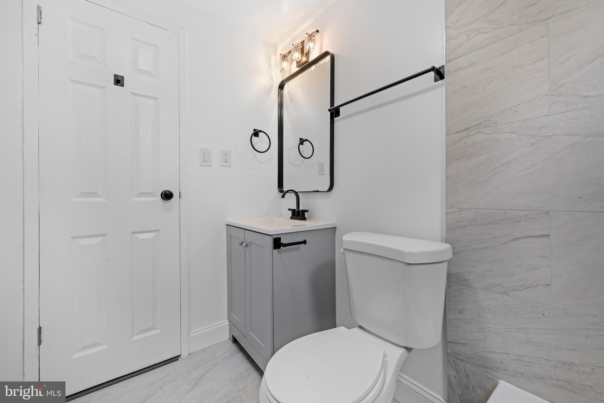 4717 1st Street Southwest, Unit 203 Washington, DC 20032 - Photo 12 of 16 Simple and clean full bath