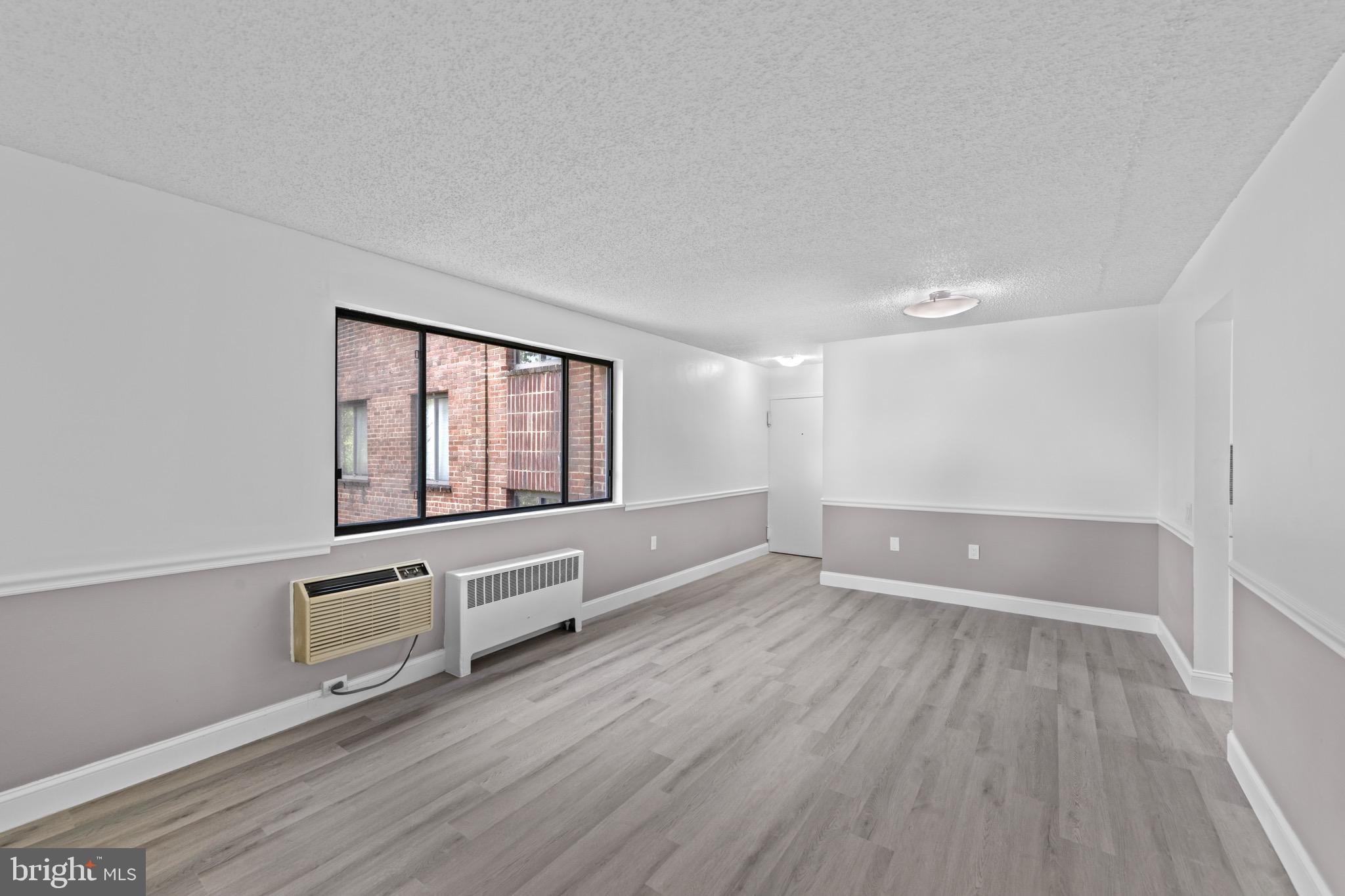 4717 1st Street Southwest, Unit 203 Washington, DC 20032 - Photo 4 of 16 Spacious living area ready for personalization