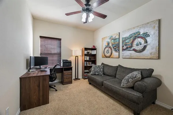 a living room with furniture and a window