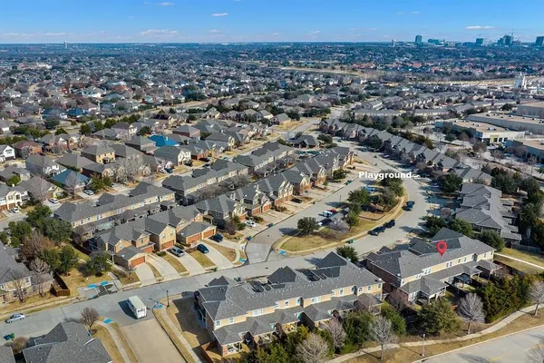 an aerial view of a city with lots of residential buildings