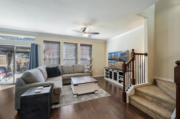 a living room with furniture and a flat screen tv