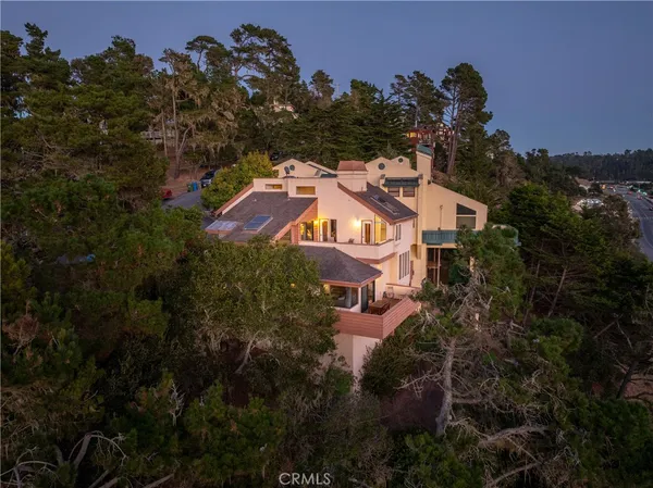 an aerial view of a house with a garden