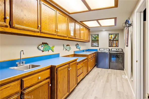 a kitchen with stainless steel appliances granite countertop a sink and cabinets