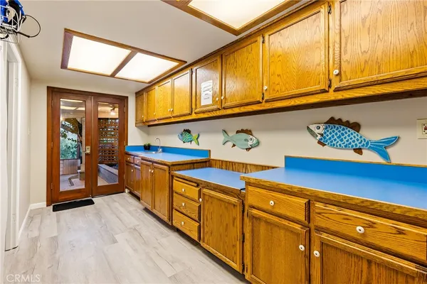 a kitchen with granite countertop cabinets and window