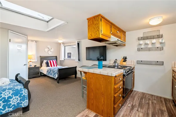 a bed room with a bed and a tv