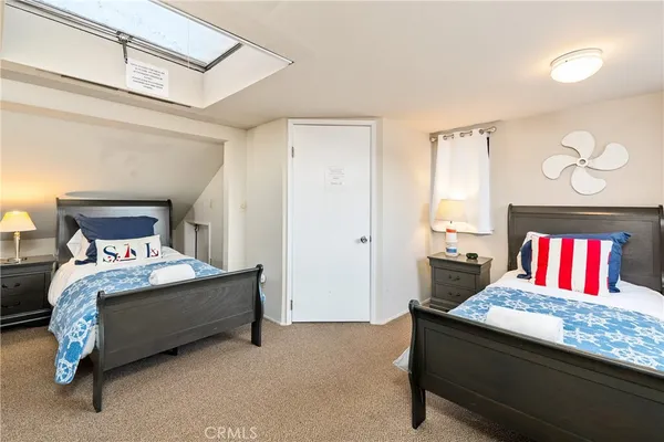 a bedroom with a bed and dresser