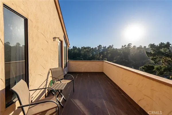 a view of balcony with furniture