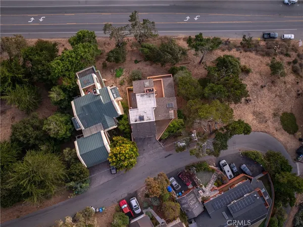 an aerial view of a house with a yard