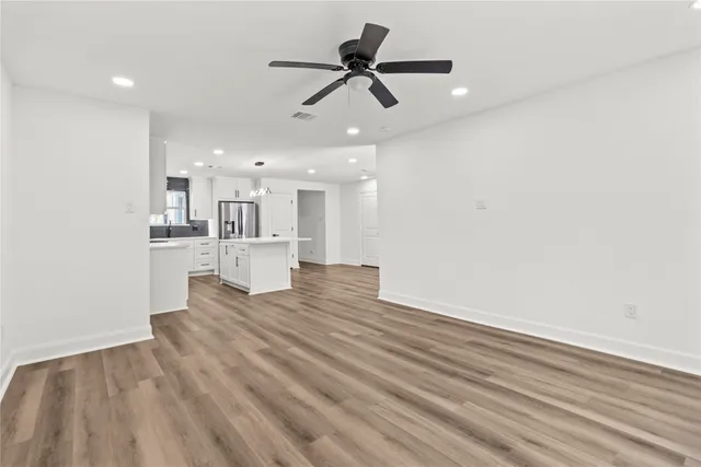 a view of kitchen with wooden floor and window