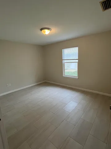 an empty room with a empty space and window