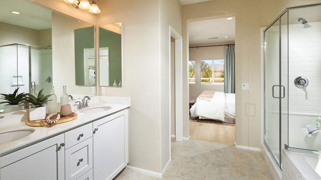 44431 Beringer Drive Indio, CA 92203 - Photo 12 of 17 a en suite bathroom with a double sink and shower