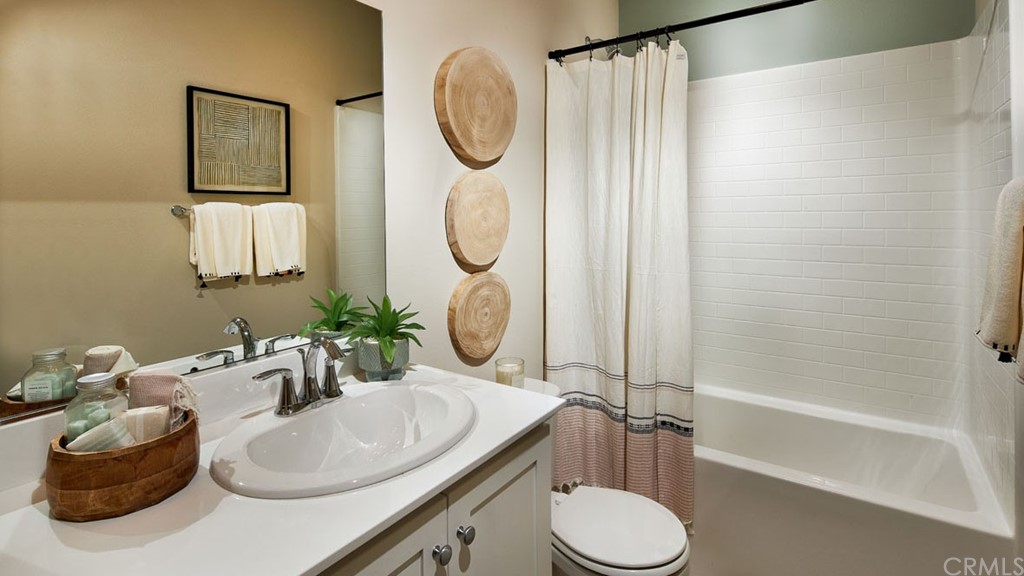 44431 Beringer Drive Indio, CA 92203 - Photo 15 of 17 a bathroom with a sink toilet and shower