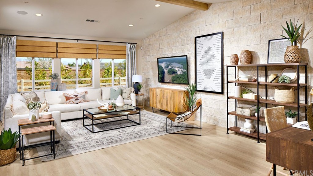 44431 Beringer Drive Indio, CA 92203 - Photo 2 of 17 a living room with furniture flat screen tv and a large window