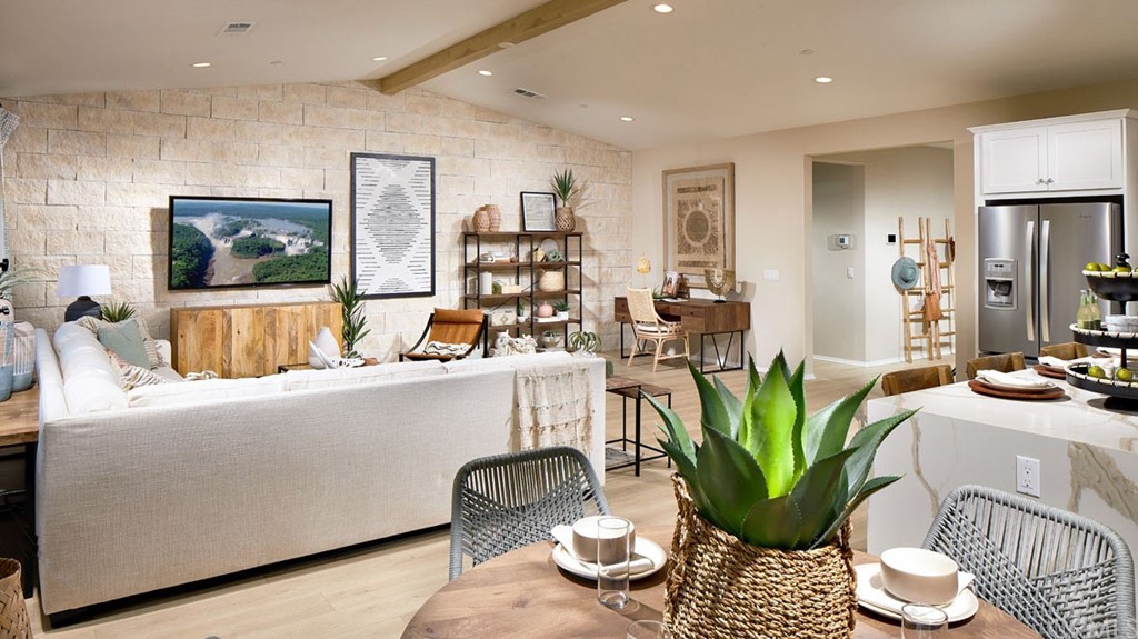 44431 Beringer Drive Indio, CA 92203 - Photo 4 of 17 a living room with furniture potted plant and a window